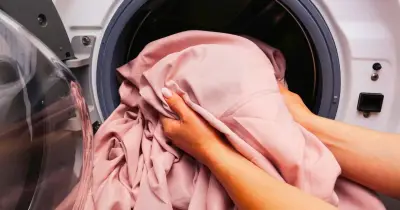 Add a towel to the dryer to stop bed sheets tangling