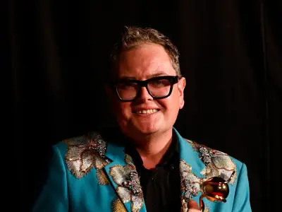 Amanda Holden kept Alan Carr's NTA award a secret for a week