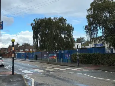 Elderly lollipop man hit by car outside Greater Manchester school