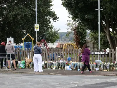 Floral tributes left after body found in search for Noah Woods
