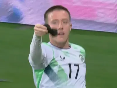 Ireland's Jack Moylan kisses black armband in Israel goal tribute
