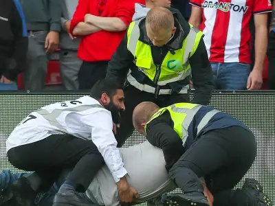 Lincoln City condemn pitch invader after Swansea defeat