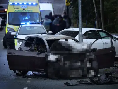 Man arrested after car bursts into flames in crash at Oldham junction