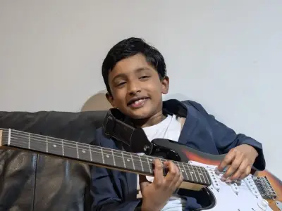 Manchester boy, 9, races to beat world guitar record