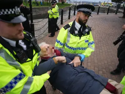 Police arrest two, including elderly man, outside Labour conference