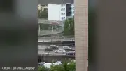 Driver sparks disbelief after red car mounts Glasgow footbridge