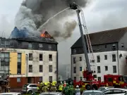 Edinburgh flats roof destroyed in huge blaze as crews tackle fire