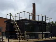 Floating sauna boat with roof deck coming to Loch Lomond