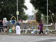 Floral tributes left after body found in search for Noah Woods
