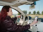 Lawyer: touching phone in holder while driving is legal with caveats