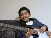 Manchester boy, 9, races to beat world guitar record
