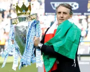 Mancini admits 'double contract' at Man City but says it's not his problem