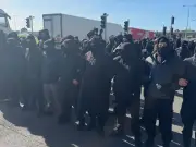 Masked protesters block Port of Dover, causing travel chaos