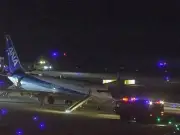 Passengers escape ANA flight via slides after 'loud boom' and emergency landing in Japan