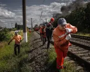 Russia targets Ukraine's rail network, killing six workers in Kyiv strikes