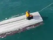 Schoolboy, 15, rescued after clinging to capsized boat for three days at sea