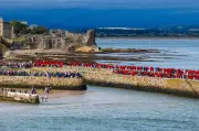 St Andrews students take part in traditional pier walk