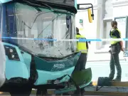 Three injured after bus crashes into 12 cars at Portslade station