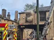 Three treated after Uppermill takeaway fire closes high street