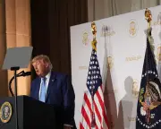 Trump unveils AI tool for federal info, vows not to stifle tech
