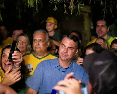 Bolsonaro's son Flávio wins first round of Brazil election