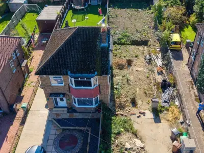 Dad who demolished half a semi-detached house then fled UK defends 'nightmare' move