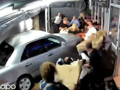 Drunk driver ploughs into packed Greek restaurant, injuring three