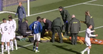 Emi Martinez stretchered off after horror clash as Chelsea match suspended
