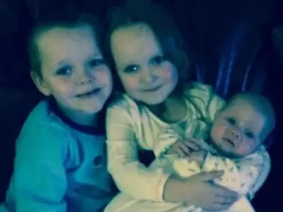 Mum died holding photo of children killed in petrol bomb attack