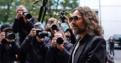 Russell Brand 'did Basil Fawlty silly walks' before raping woman, court told