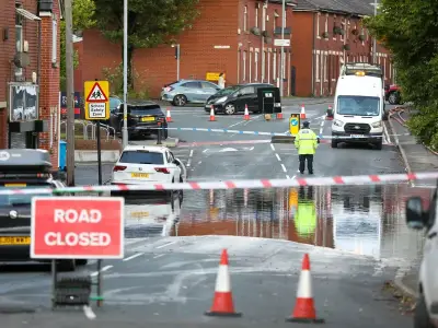 Severe flooding closes Oldham road as crews pump water from five properties
