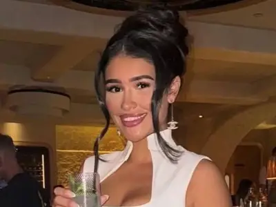 Woman, 26, killed in horror stabbing named and pictured as resident 'woke by screaming'