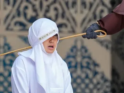 Woman collapses after public caning for sex outside marriage in Aceh