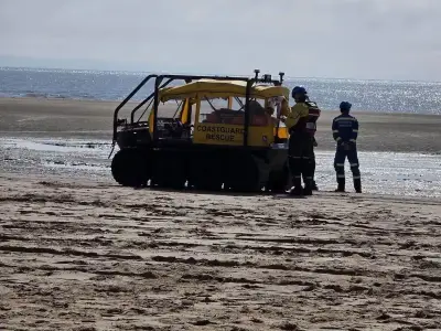 Woman rescued after getting stuck knee-deep in mud at Crosby Beach