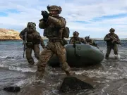 British commandos ride German submarine in major war exercise