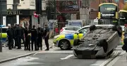 Car flips onto roof in Manchester city centre crash