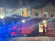 Cordon in place as fire tears through flat above Chorlton shop
