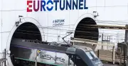 Freight train hits overturned bus at Channel Tunnel entrance