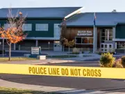 Hero teacher wrestles Oregon school shooter as dad fatally wounds teen
