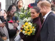 Meghan kisses well-wisher as Harry and Meghan greet crowds in Nottingham
