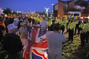 Migrants arrive in Gosport as protesters gather at scene