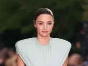Miranda Kerr, 43, returns to catwalk after a decade and showcases rock-hard abs