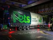 Pets at Home lorry wedged under railway bridge in Walkden