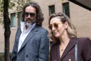 Russell Brand's Wife Laura Gallacher 'Determined' to Support Him in Rape Trial