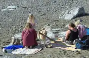 Seaside crowds gather on one of hottest October days on record