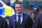 Tommy Robinson appears in court over journalist harassment claims