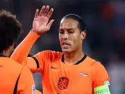 Van Dijk marks 100th Netherlands cap with son by his side