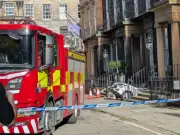 Woman charged after car crashes into Edinburgh basement